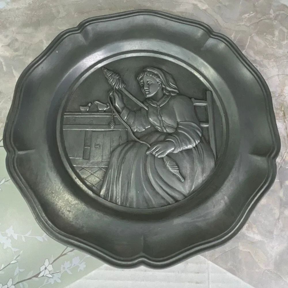 Vintage Cheswick PA action industries high relief pewter. Woman spinning yarn.